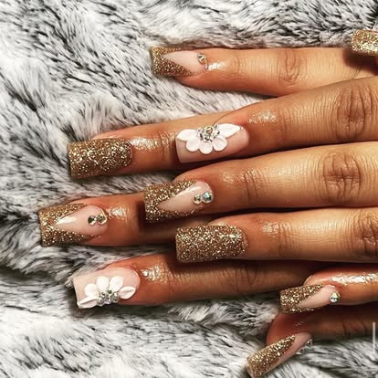 Gold glitter nails with dimensional white flowers