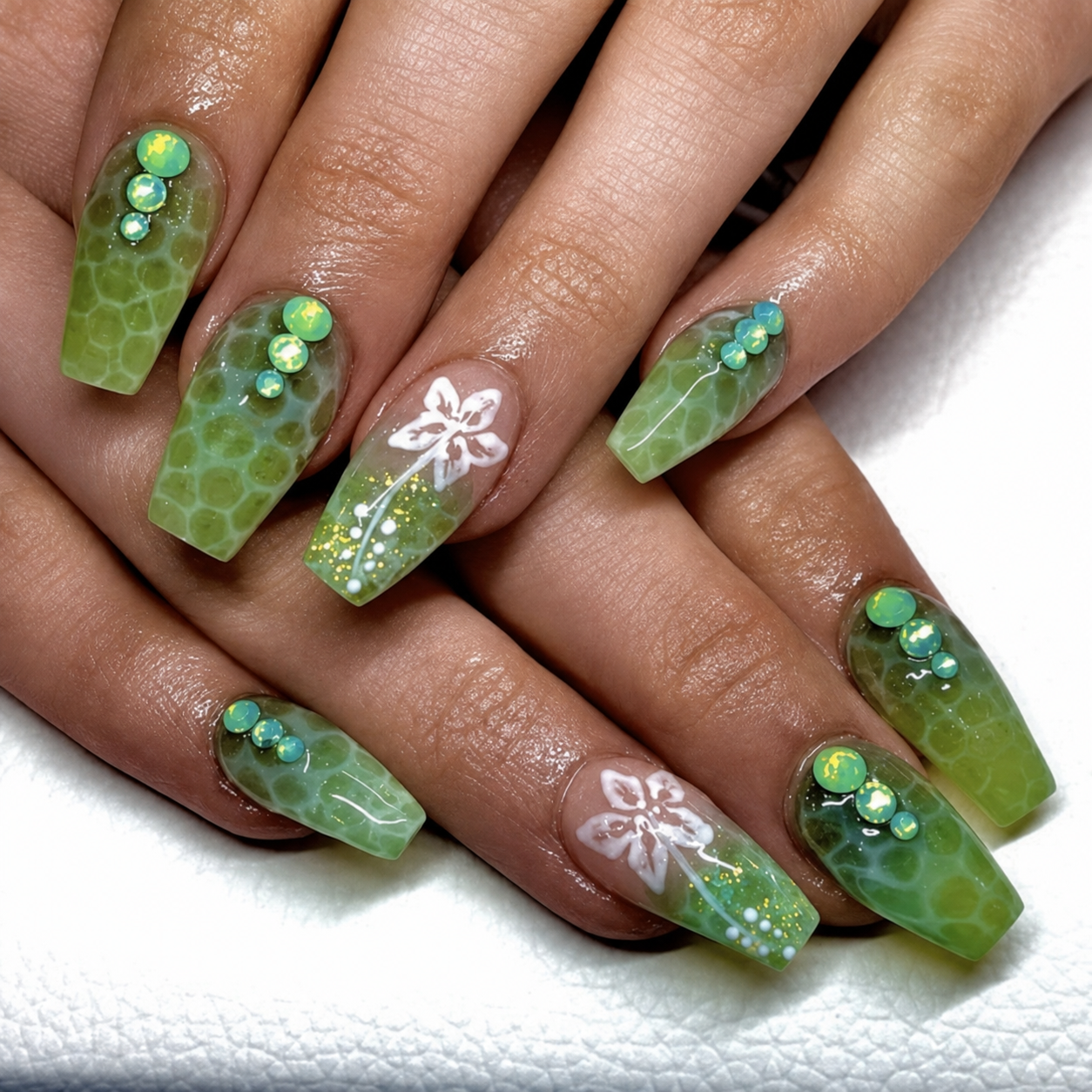 Green custom nail set with gems and floral art