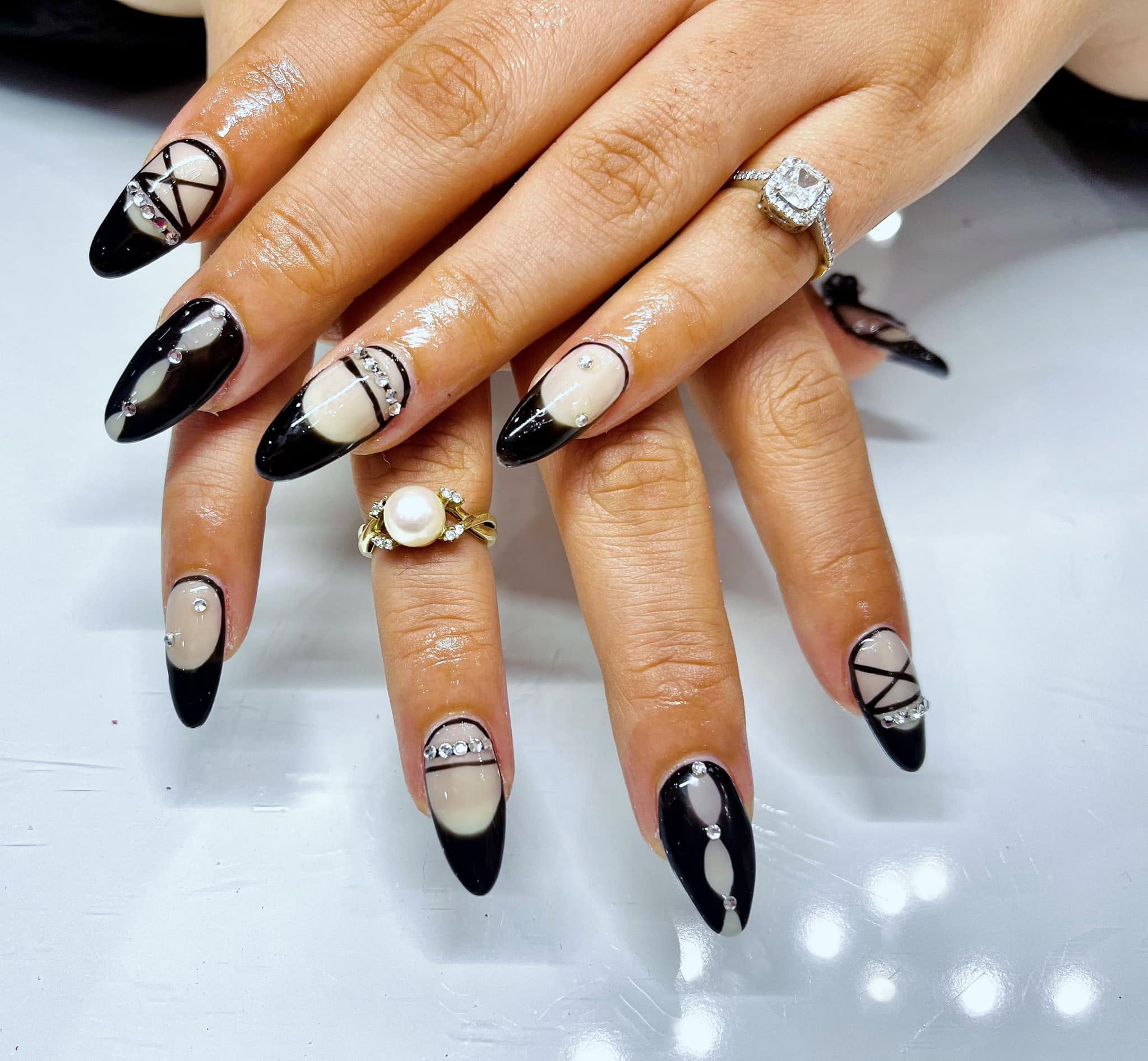 Black and neutral geometric nail set with crystal details